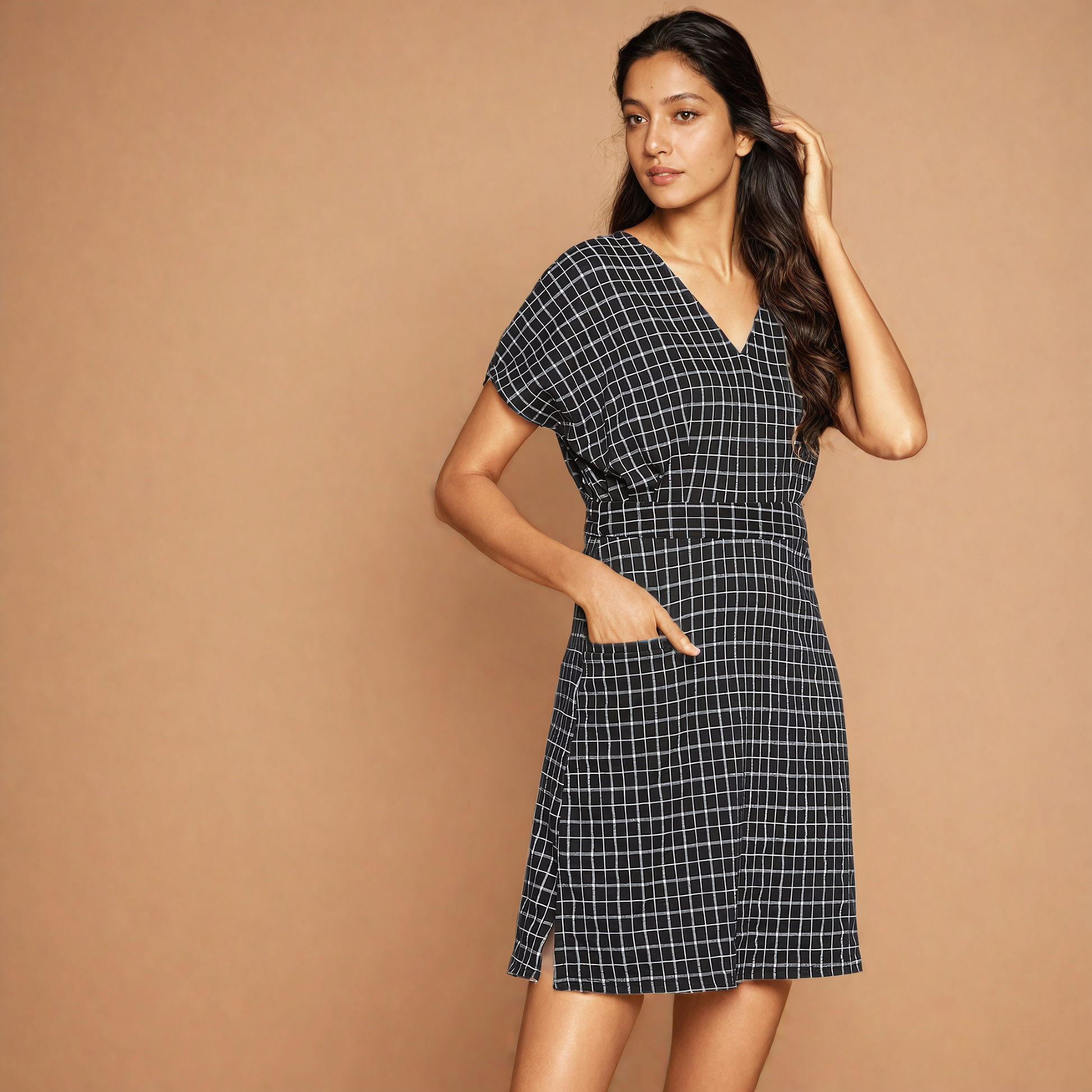 "Stand out in style with this trendy checkered black dress, sure to turn heads wherever you go."